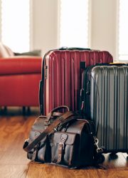 Suitcases sitting in a home, preparing for travel.